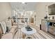 Bright living room with an open floor plan to the kitchen with barstool seating and modern light fixtures at 830 San Marco Ct. # 2603-B, Myrtle Beach, SC 29579