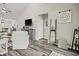 Open living room space with wood floors, modern decor, television, and access to the kitchen at 830 San Marco Ct. # 2603-B, Myrtle Beach, SC 29579