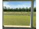 A view of the home's backyard and pond showing a spacious lawn and natural surroundings at 958 Oak Hollow St., Longs, SC 29568