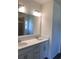 Bathroom with double sink vanity, large mirror, and tile floors at 958 Oak Hollow St., Longs, SC 29568