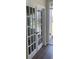 Elegant white French doors with glass panes and dark wood floors, enhancing natural light at 958 Oak Hollow St., Longs, SC 29568