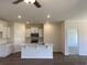 Modern kitchen with white cabinets, stainless steel appliances, quartz countertops, and a kitchen island at 958 Oak Hollow St., Longs, SC 29568
