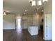 Spacious living area with views of the kitchen featuring an island, stainless appliances and lots of light at 958 Oak Hollow St., Longs, SC 29568