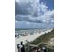 A beautiful beach is full of people on a sunny day with large clouds in the sky at 962 Oak Hollow St., Longs, SC 29568