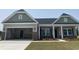 Charming single-story home featuring a two-car garage and stone accents at 962 Oak Hollow St., Longs, SC 29568