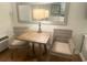 Cozy dining area with a wooden table and comfortable wicker chairs at 1 Norris Dr. # 210, Pawleys Island, SC 29585