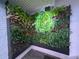 Vertical garden with plants and neon sign at 1 Norris Dr. # 210, Pawleys Island, SC 29585