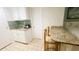 Modern kitchenette area with countertop seating at 1 Norris Dr. # 210, Pawleys Island, SC 29585
