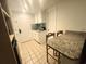 Bright kitchenette with granite countertops, white cabinets, and essential appliances at 1 Norris Dr. # 210, Pawleys Island, SC 29585