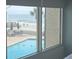 Serene pool area with inviting lounge chairs and a view of the ocean at 1 Norris Dr. # 210, Pawleys Island, SC 29585