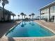 Exterior pool with a view of the beach and ocean in the background at 1 Norris Dr. # 210, Pawleys Island, SC 29585
