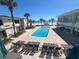 Inviting pool area surrounded by palm trees and comfortable lounge chairs at 1 Norris Dr. # 210, Pawleys Island, SC 29585