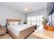 Cozy bedroom with a ceiling fan, bright natural light, and warm neutral tones at 100 Birch N Coppice Dr. # 12, Surfside Beach, SC 29575