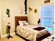 Adorable bedroom featuring a twin bed, whimsical decor, and a bright window view at 100 Birch N Coppice Dr. # 12, Surfside Beach, SC 29575