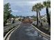 Community entrance with brick signage and manicured flowerbeds, welcoming residents and visitors at 100 Birch N Coppice Dr. # 12, Surfside Beach, SC 29575
