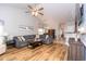 Open-concept living room showcasing natural light, hardwood floors, and a comfortable couch at 100 Birch N Coppice Dr. # 12, Surfside Beach, SC 29575