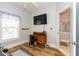 Office space with a desk, chair, television and natural light streaming in from the window at 100 Birch N Coppice Dr. # 12, Surfside Beach, SC 29575