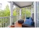 Relaxing screened-in patio offers comfortable seating and views of lush greenery at 100 Birch N Coppice Dr. # 12, Surfside Beach, SC 29575
