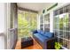 Inviting screened-in patio with comfortable seating and a 'Margaritaville' vibe at 100 Birch N Coppice Dr. # 12, Surfside Beach, SC 29575