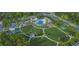 An aerial view of community pool, playground, tennis court, and green space at 1079 Milford Way, Myrtle Beach, SC 29588