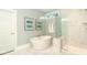 Elegant bathroom with a freestanding tub, glass shower, and marble tile flooring at 1079 Milford Way, Myrtle Beach, SC 29588