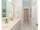 Bathroom featuring a dual sink vanity, framed mirror, and tile flooring at 1079 Milford Way, Myrtle Beach, SC 29588