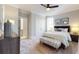 Well-lit bedroom showcases a bed, dresser, and an upholstered bench at 1079 Milford Way, Myrtle Beach, SC 29588