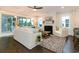 Bright living room with a cozy fireplace, white furniture, and a glass sliding door at 1079 Milford Way, Myrtle Beach, SC 29588