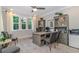 Bright office with gray accents, built-in shelves, and a large window overlooking the yard at 1079 Milford Way, Myrtle Beach, SC 29588