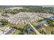 Aerial view of a residential community with a pond, surrounding trees, and well-manicured lawns at 1135 Sennema Circle, Myrtle Beach, SC 29588