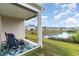 Relaxing back porch view with chairs overlooking a serene pond in a beautiful community at 1135 Sennema Circle, Myrtle Beach, SC 29588