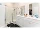 Modern bathroom features dual vanities, mirrors, and a glass-enclosed shower at 1135 Sennema Circle, Myrtle Beach, SC 29588
