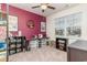 Bedroom featuring gray carpet, a burgundy accent wall, a ceiling fan, and natural light at 1135 Sennema Circle, Myrtle Beach, SC 29588