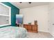 Bedroom featuring gray carpet, a teal accent wall, a ceiling fan, and natural light at 1135 Sennema Circle, Myrtle Beach, SC 29588