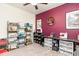 Bedroom featuring gray carpet, a burgundy accent wall, a ceiling fan, and natural light at 1135 Sennema Circle, Myrtle Beach, SC 29588