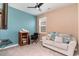 Bedroom featuring gray carpet, beige and blue walls, ceiling fan, and natural light at 1135 Sennema Circle, Myrtle Beach, SC 29588