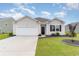 Charming single-story home with a manicured lawn and a one car garage in a well maintained community at 1135 Sennema Circle, Myrtle Beach, SC 29588