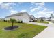 Well kept single-story home with an attached garage, complemented by landscaped yard and a serene neighborhood setting at 1135 Sennema Circle, Myrtle Beach, SC 29588