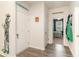 Hallway with gray flooring, white doors and trim, and decor with beachy vibe at 1135 Sennema Circle, Myrtle Beach, SC 29588