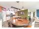 Bright eat-in kitchen features granite counters, stainless appliances, and modern pendant lighting at 1135 Sennema Circle, Myrtle Beach, SC 29588