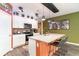 Charming kitchen showcases a spacious island, granite countertops, and stainless appliances at 1135 Sennema Circle, Myrtle Beach, SC 29588