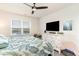 Bright bedroom with large windows, ceiling fan, and serene backyard view at 1135 Sennema Circle, Myrtle Beach, SC 29588