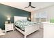 Comfortable main bedroom with green accent wall, fan, and abundant natural light at 1135 Sennema Circle, Myrtle Beach, SC 29588