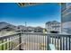 Balcony view from the property with nearby houses and ocean visible in the distance at 1208 S Ocean Blvd. # H, North Myrtle Beach, SC 29582
