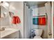 Cozy bathroom featuring a functional toilet, sink, vanity, and well-lit mirror for daily routines at 1208 S Ocean Blvd. # H, North Myrtle Beach, SC 29582