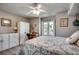 Cozy bedroom with a ceiling fan, closet, and a sliding glass door with a view of outside at 1208 S Ocean Blvd. # H, North Myrtle Beach, SC 29582