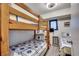 Charming bedroom with twin beds, bunk bed, and nautical decor, perfect for children or guests at 1208 S Ocean Blvd. # H, North Myrtle Beach, SC 29582