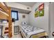 Comfortable bedroom with twin bed, bunk bed, stylish nautical decor, and ample space for relaxation at 1208 S Ocean Blvd. # H, North Myrtle Beach, SC 29582