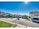 Street view of houses, with some elevated on stilts, with view of ocean in the background at 1208 S Ocean Blvd. # H, North Myrtle Beach, SC 29582