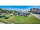 Spacious home with lush lawn, mature trees, palm accents, and convenient nearby city amenities at 1208 S Ocean Blvd. # H, North Myrtle Beach, SC 29582